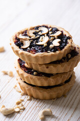 tartlets with apple jam and blueberry confiture