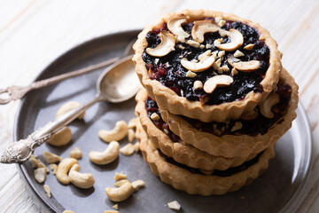 tartlets with apple jam and blueberry confiture