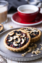 tartlets with apple jam and blueberry confiture