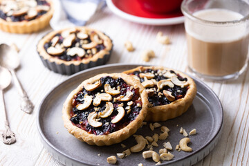 tartlets with apple jam and blueberry confiture