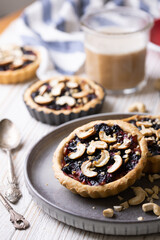 tartlets with apple jam and blueberry confiture