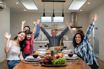 Portrait of Multi-ethnic family having evening dinner party in house.