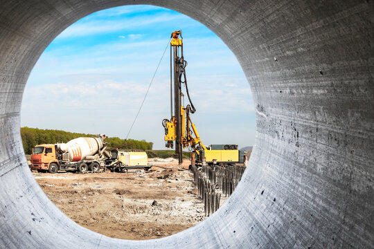 Hydraulic drilling machine at the construction site makes piles. Pile field. Modern drilling rig.