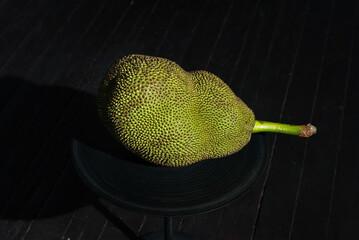 jackfruit tropical fruit on a black background.