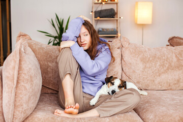 Sad depressed young adult woman crying alone at home, upset