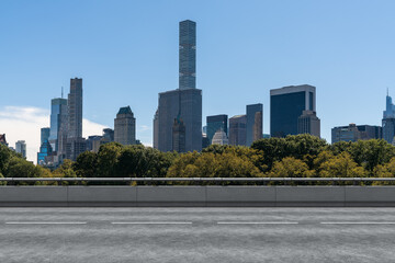 Empty urban asphalt road exterior with city buildings background. New modern highway concrete construction. Concept of way to success. Transportation logistic industry fast delivery. New York. USA.