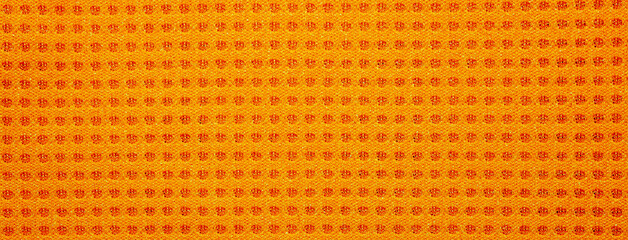 The texture of orange nylon mesh.Mesh made of nylon fabric. Orange nylon mesh background.