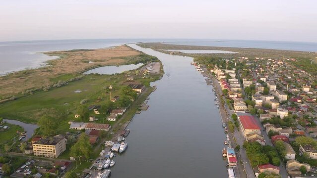 Aerial view of Chilia old town and the port on the Kilya waterway on Danube river. Danube delta Romania. The port of Chilia. Maritime navigation arm and border point. Chilia Veche, Romania and Ukraine
