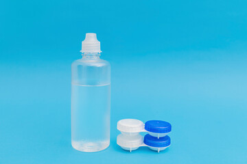 Subject photography of contact lenses on a blue background, with lens fluid