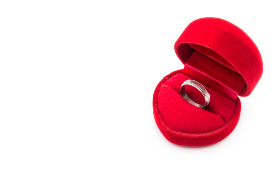 Abstract white love ring on Red Velvet heart box for engagement ring on white. Valentine picture background.