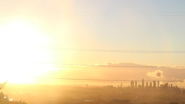 No color grade was needed for this set of clips. The sunrise after a great storm in LA, California. The mist rising from the earth evaporating as the golden rays glare across the city.