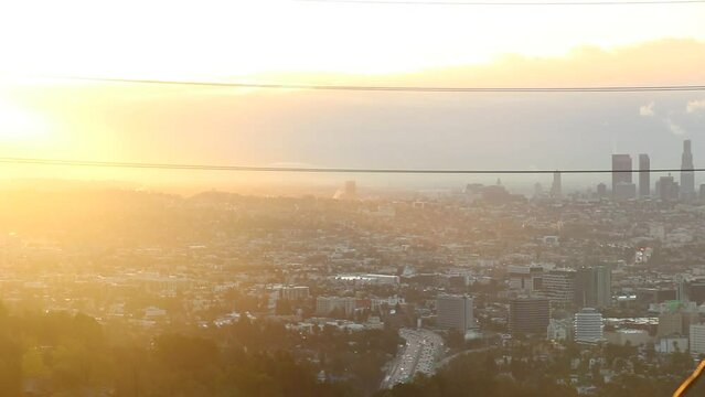 No color grade was needed for this set of clips. The sunrise after a great storm in LA, California. The mist rising from the earth evaporating as the golden rays glare across the city.