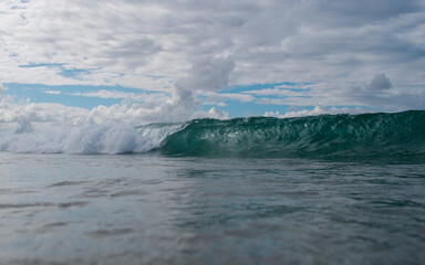 Fototapeta na wymiar Small wave breaking in the ocean.