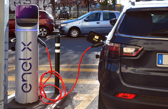 Turin, Piedmont, Italy -11-18-2022- Electric urban charging station for vehicles in car sharing.