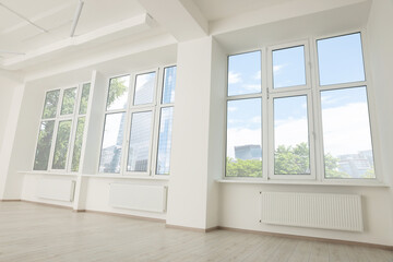 Naklejka na ściany i meble Modern office room with white walls and windows. Interior design