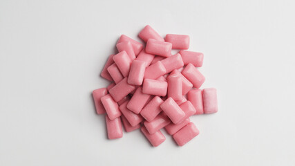 Sweet chewing gums on white background, top view