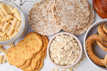 Different gluten free products on light grey table, flat lay