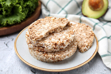 Crunchy buckwheat cakes on white table, closeup