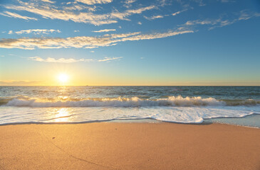 Fototapeta premium Sandy seashore at sunset.