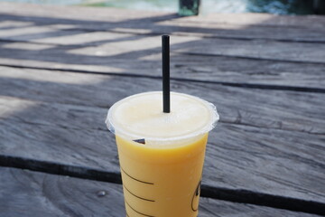 selectively focus on mango juice drinks that use plastic cups