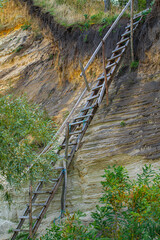cliff with wooden old stairs