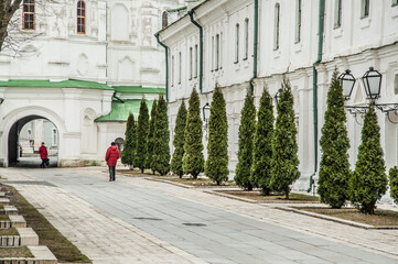 Two people in red jackets on the territory of Kiev Pechersk Lavra in Kiev.
