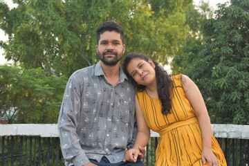 lovely young indian couple with nature background