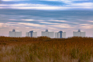 Fototapeta na wymiar Oil Storage Tanks on Texas Gulf Coast Salt Marsh