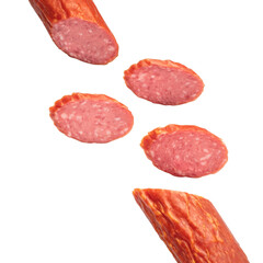 Slices of sausage salami on white background  flying concept