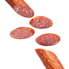 Slices of sausage salami on white background  flying concept