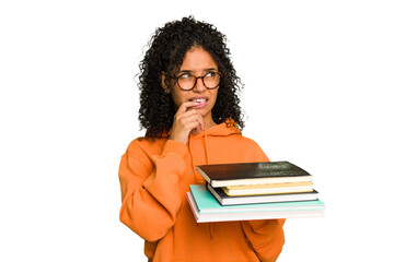 Young student woman holding a pile of books isolated relaxed thinking about something looking at a copy space.