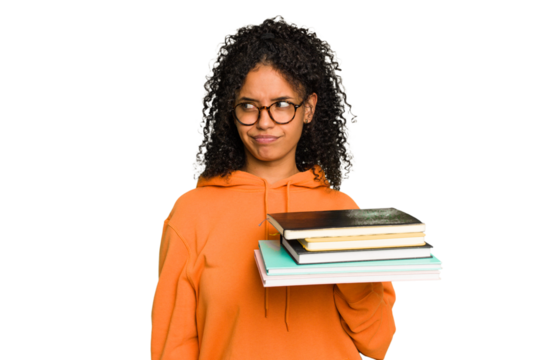 Young student woman holding a pile of books isolated confused, feels doubtful and unsure.