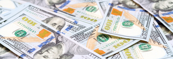 Obraz na płótnie Canvas New design US dollar bills as banner. Money background. American cash. Finance and economy concepts.