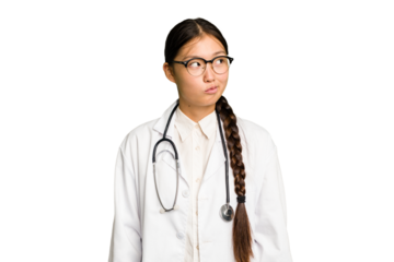 Young doctor asian woman isolated confused, feels doubtful and unsure.