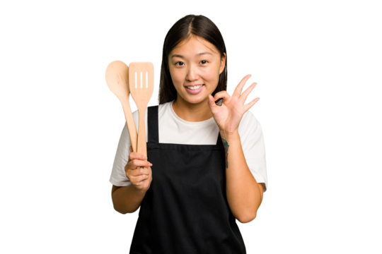 Young asian cook woman isolated cheerful and confident showing ok gesture.
