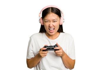 Young asian gamer woman playing with a game controller and headphones isolated © Asier
