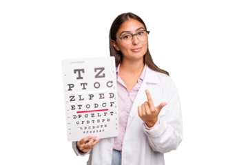 Young caucasian oculist woman isolated pointing with finger at you as if inviting come closer.