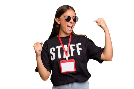 Young caucasian staff woman wearing a badge isolated raising fist after a victory, winner concept.