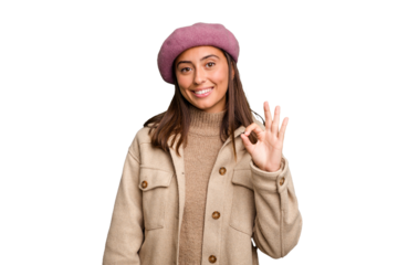 Young caucasian woman wearing winter jacket isolated cheerful and confident showing ok gesture.
