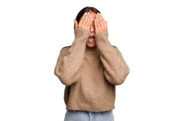 Young cute caucasian woman isolated having fun covering half of face with palm.