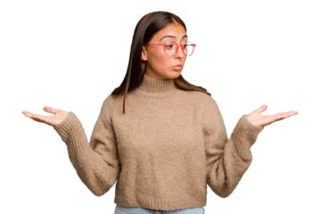 Young cute caucasian woman isolated confused and doubtful shrugging shoulders to hold a copy space.