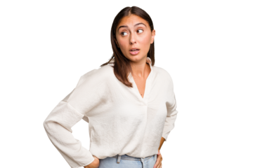 Young cute caucasian woman isolated looks aside smiling, cheerful and pleasant.