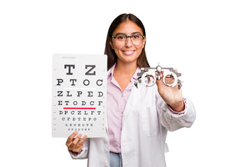 Young caucasian oculist woman holding a optometry test and glasses isolated