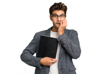 Young teacher caucasian man holding a book isolated biting fingernails, nervous and very anxious.