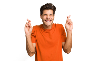 Young caucasian handsome man isolated crossing fingers for having luck