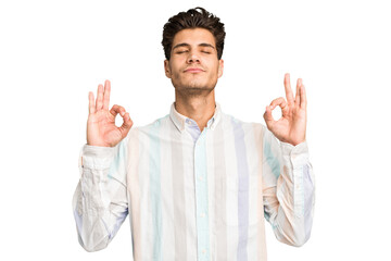 Naklejka premium Young caucasian handsome man isolated relaxes after hard working day, she is performing yoga.