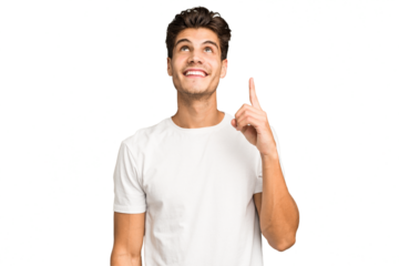 Young caucasian handsome man isolated indicates with both fore fingers up showing a blank space.