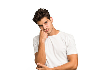 Fototapeta premium Young caucasian handsome man isolated tired of a repetitive task.