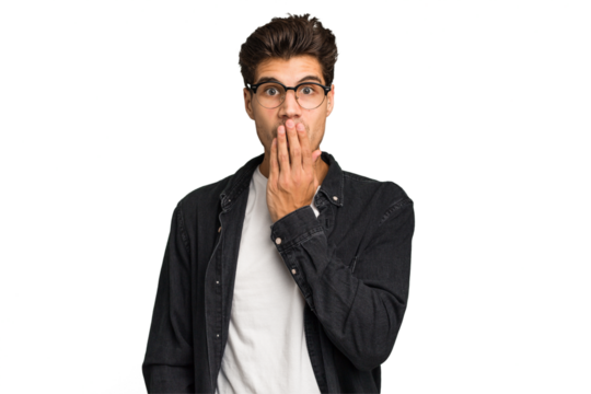 Young caucasian handsome man isolated shocked, covering mouth with hands, anxious to discover something new.