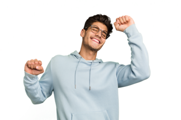 Young caucasian handsome man isolated celebrating a special day, jumps and raise arms with energy.